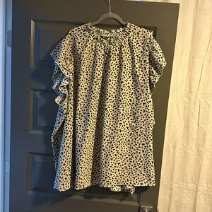 Bloomchic animal print top with ruffle sleeves and stretch crew neck!